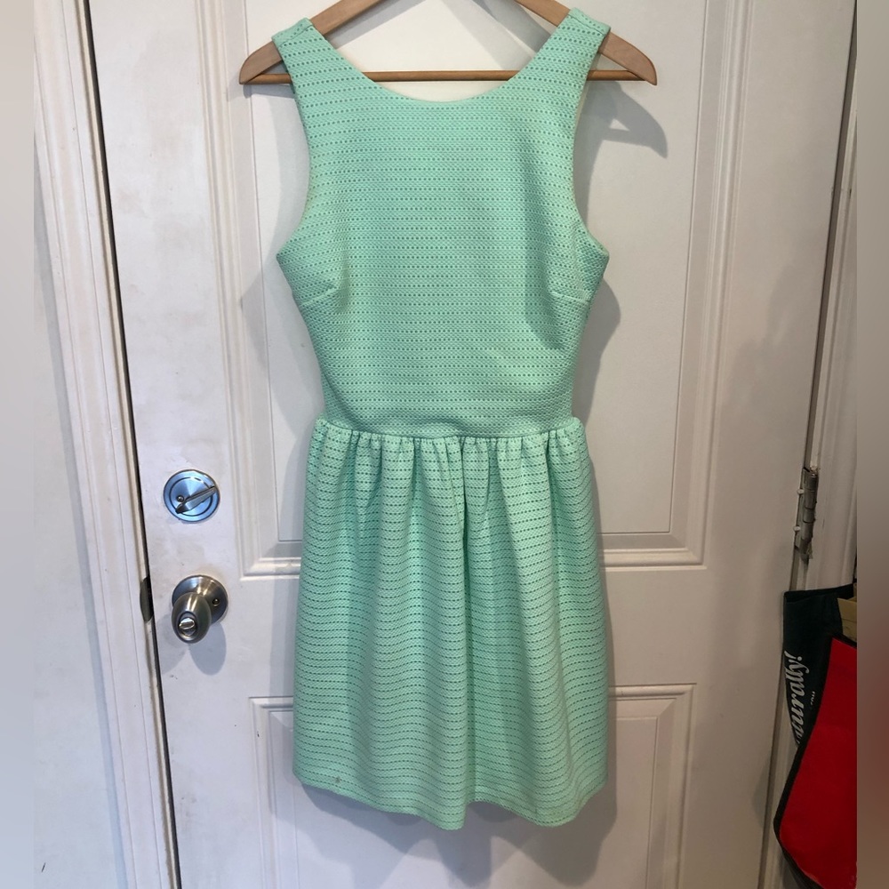 Attractive deep cut back dress in seafoam green size small with flared skirt